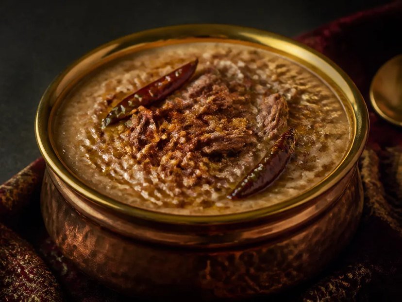 Harissa cooking slowly in a heavy copper pot